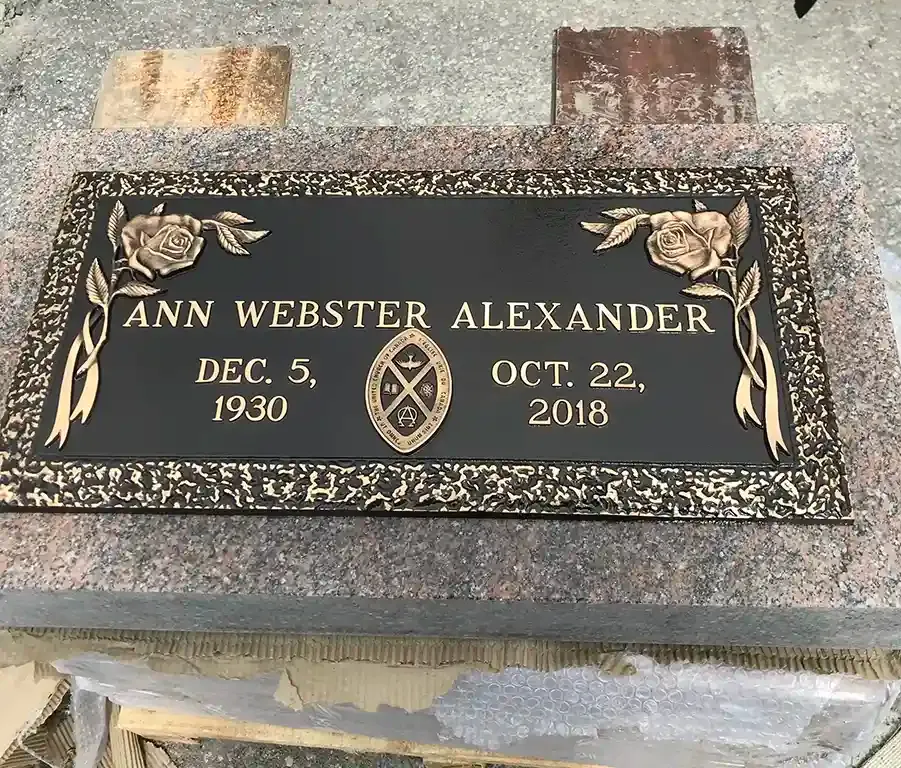 Memorial monuments and markers displayed in a serene outdoor setting