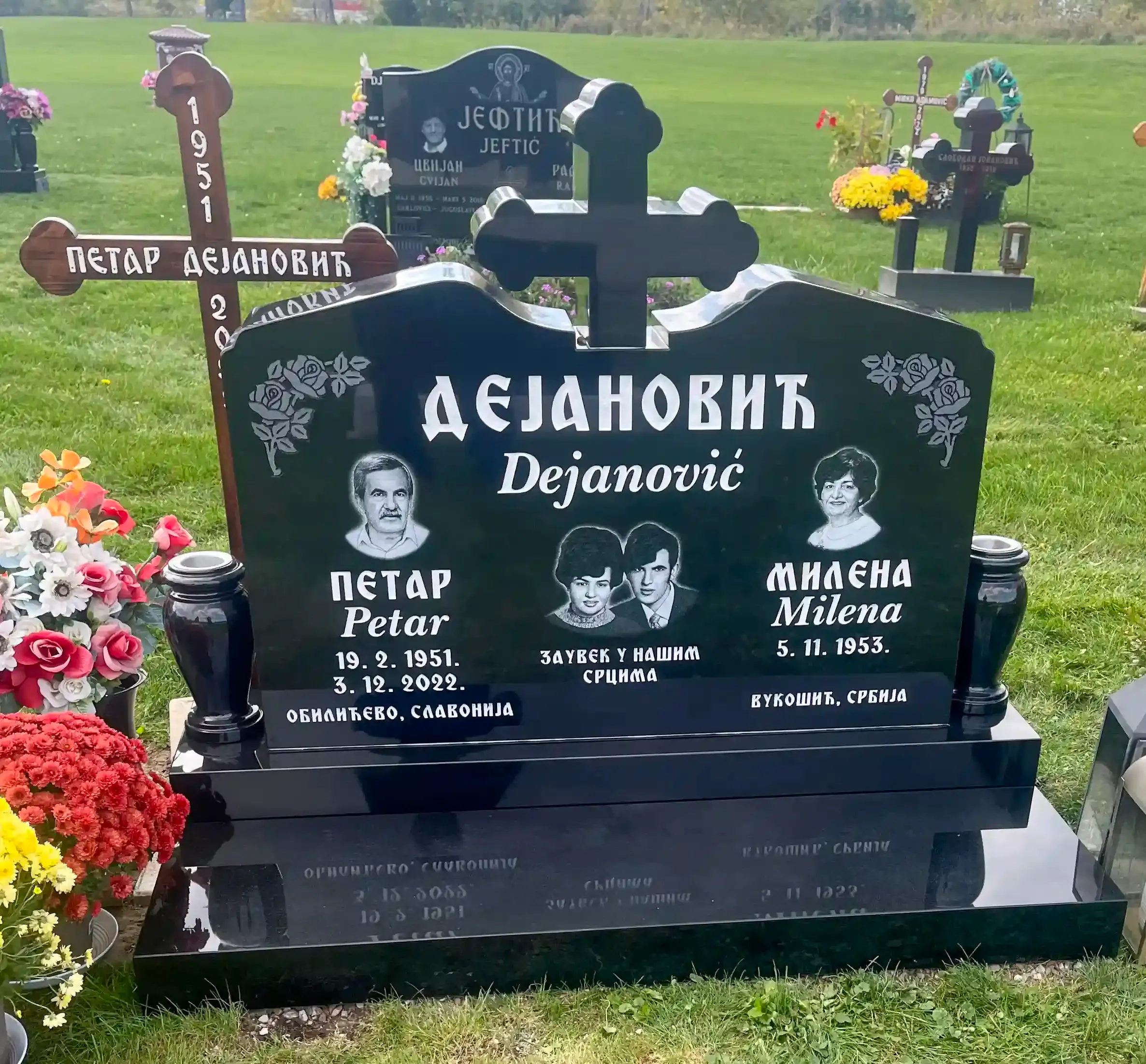 Memorial monuments and markers displayed in a serene outdoor setting