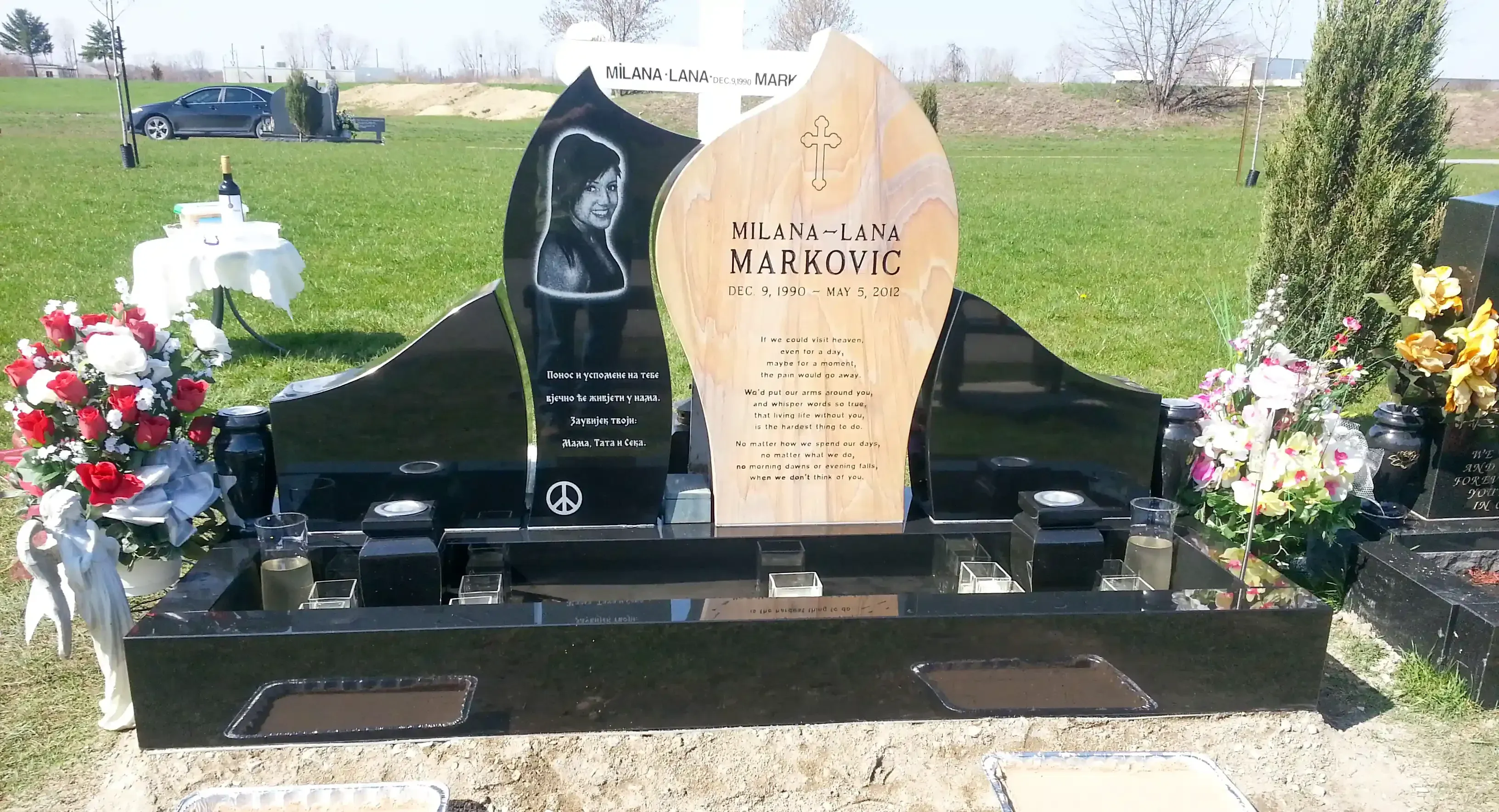 Memorial monuments and markers displayed in a serene outdoor setting