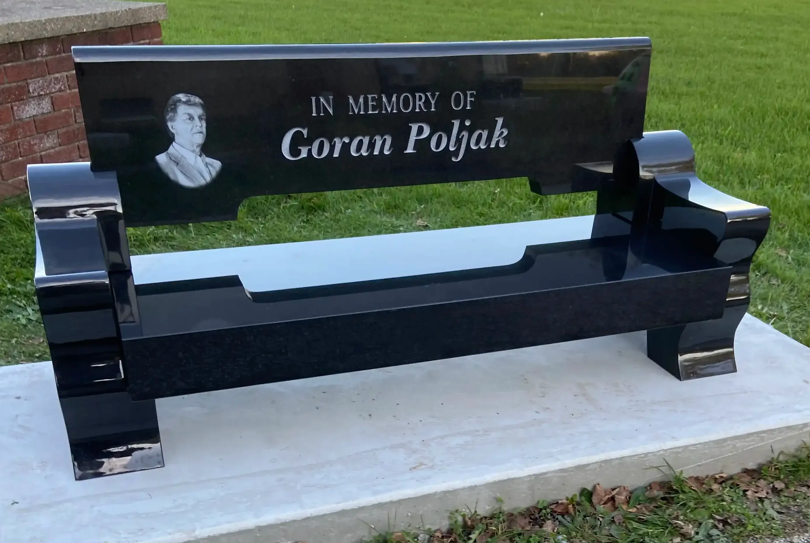 Memorial accessories granite bench and vase in a serene outdoor setting